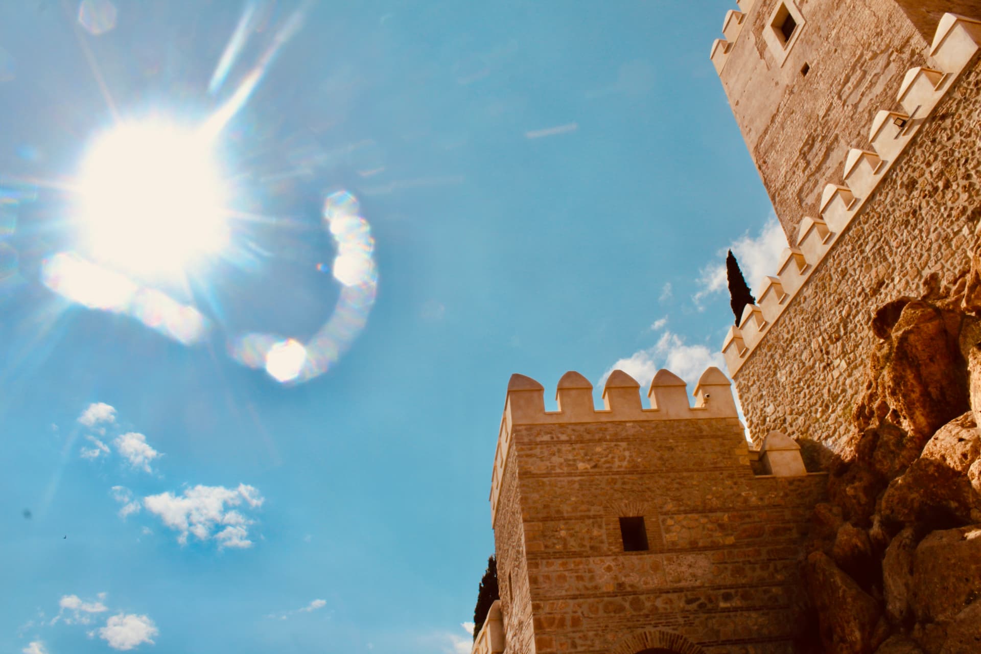 Sunlight over a castle tower in Almería