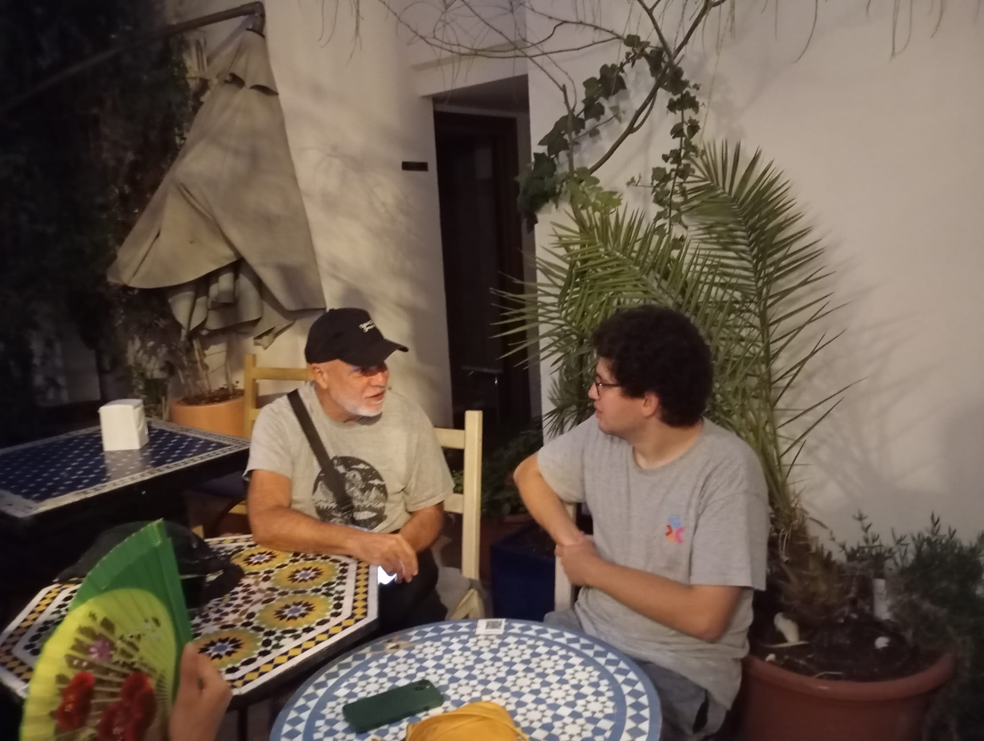 Two guests talking over drinks at a night exchange