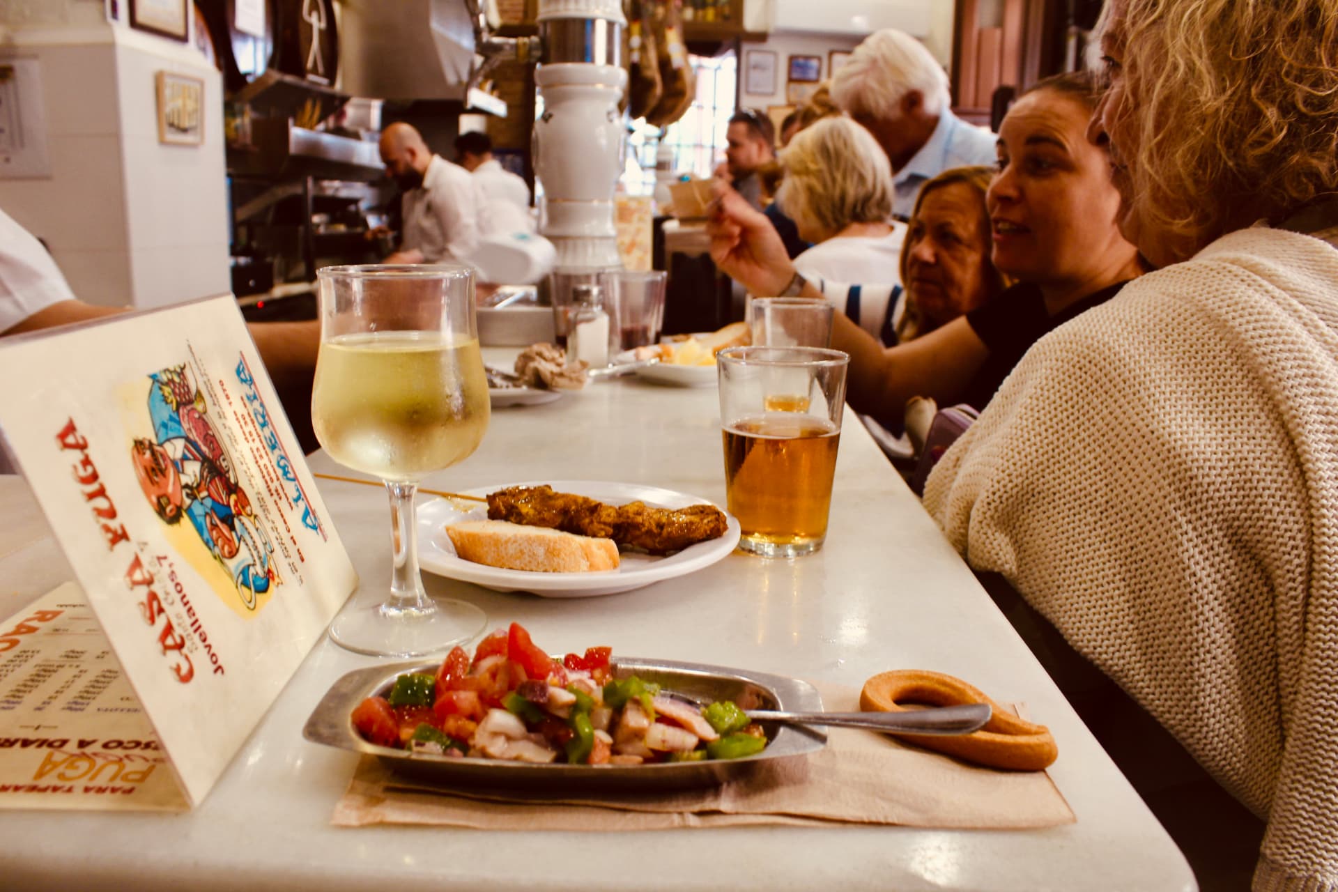 Friends sharing tapas and conversation in Almería